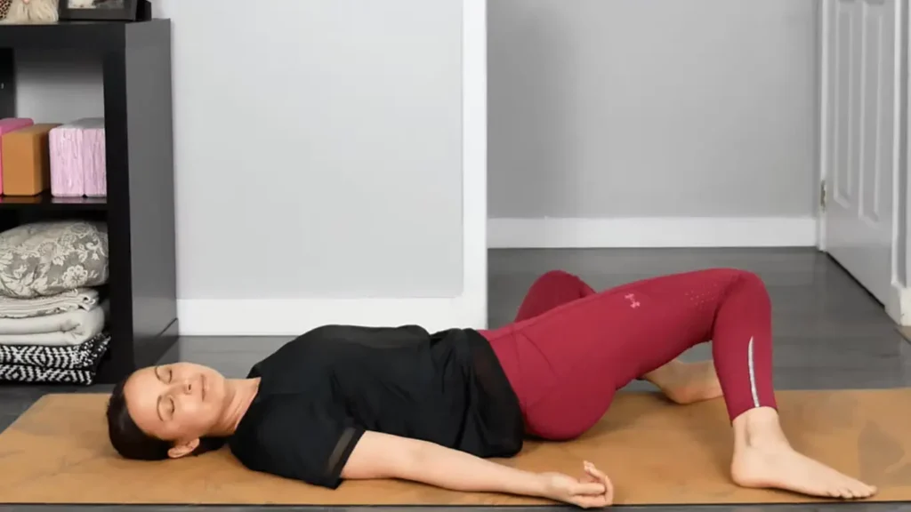 Somatic Pilates instructor demonstrating floor-based movement