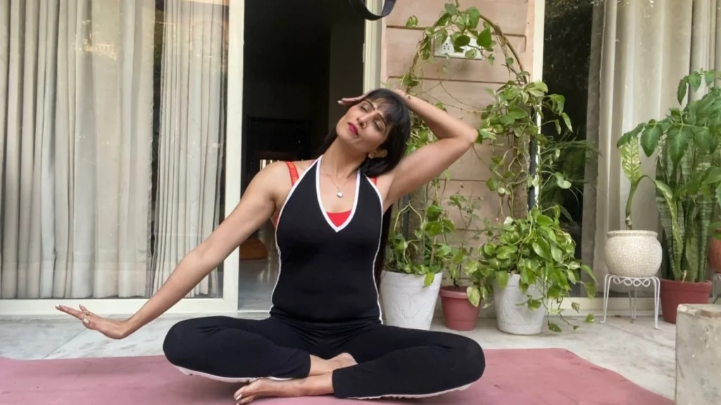 Seated neck stretch for tension relief in somatic Pilates