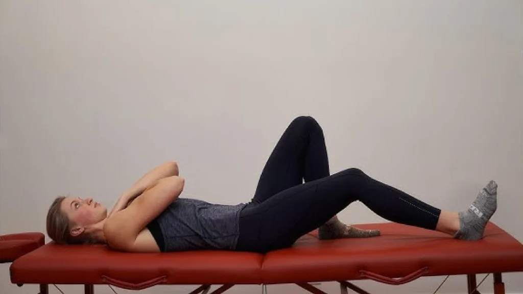 Restorative somatic movement on back with knees bent