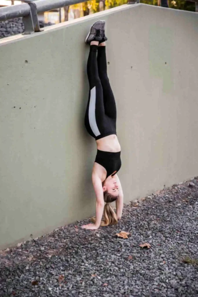 Person practicing Legs Up the Wall (Viparita Karani) with legs extended vertically for relaxation and stress relief.