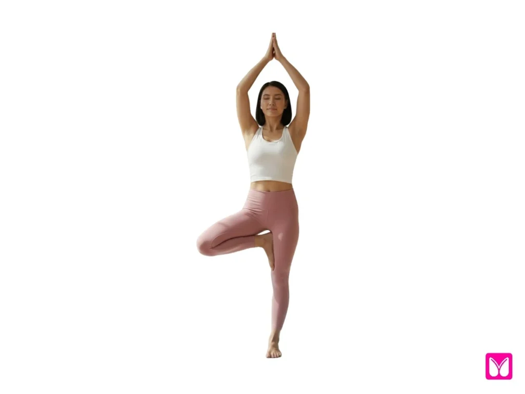A woman demonstrating Tree Pose (Vrksasana), a key posture in yoga for beginners designed to improve focus and physical balance.